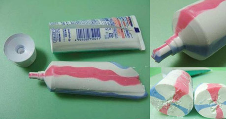 Por que a pasta de dentes saem colorida de dentro do tubo?