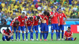 Chile players look on preparing for penalty kicks