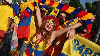 Fans of Colombia pose outside